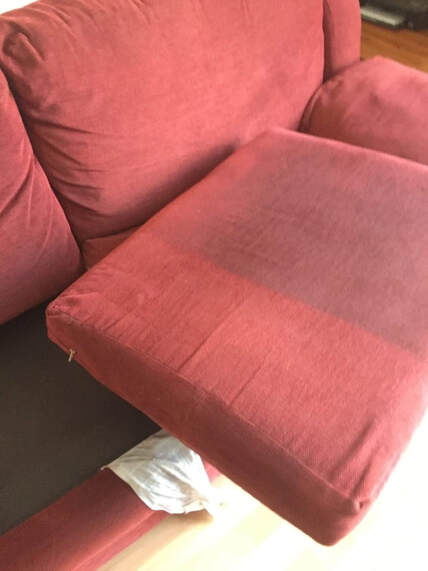 a couch that is inthe middle of being cleaned in mesa, az